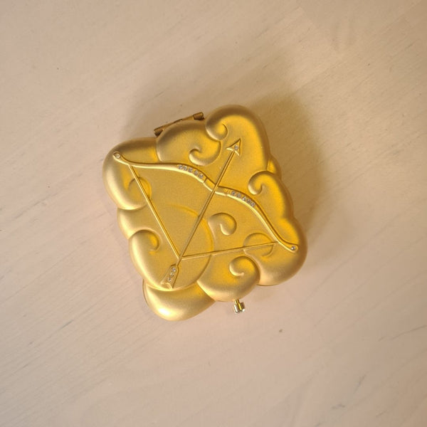 Vintage Estée Lauder poederdoos X Boogschutter broche